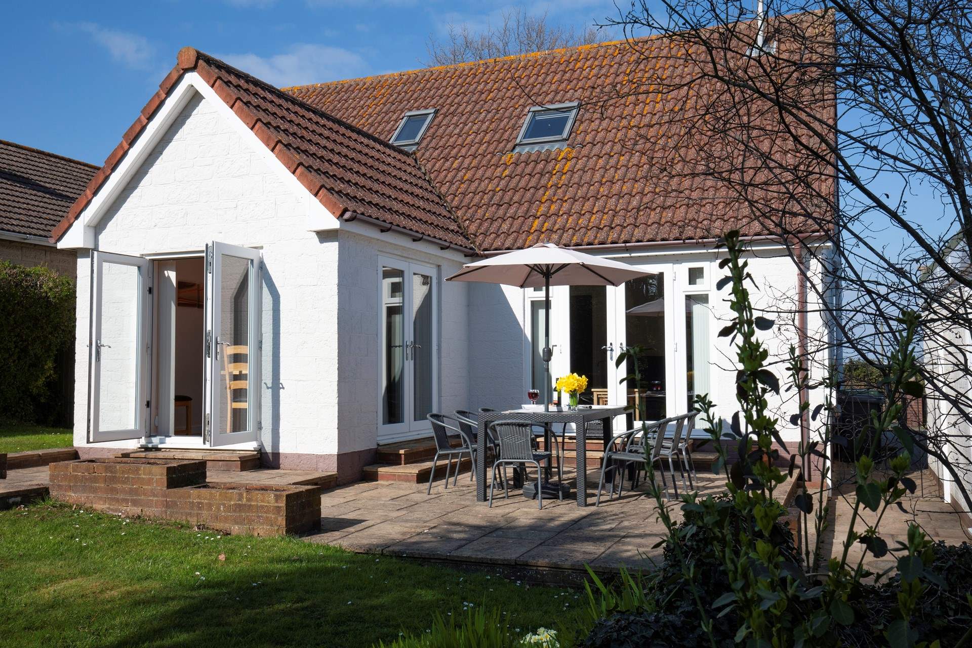 The rear garden at Garsdon. Perfect for al fresco dining. 