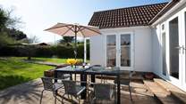 There's a large patio-area with garden furniture.