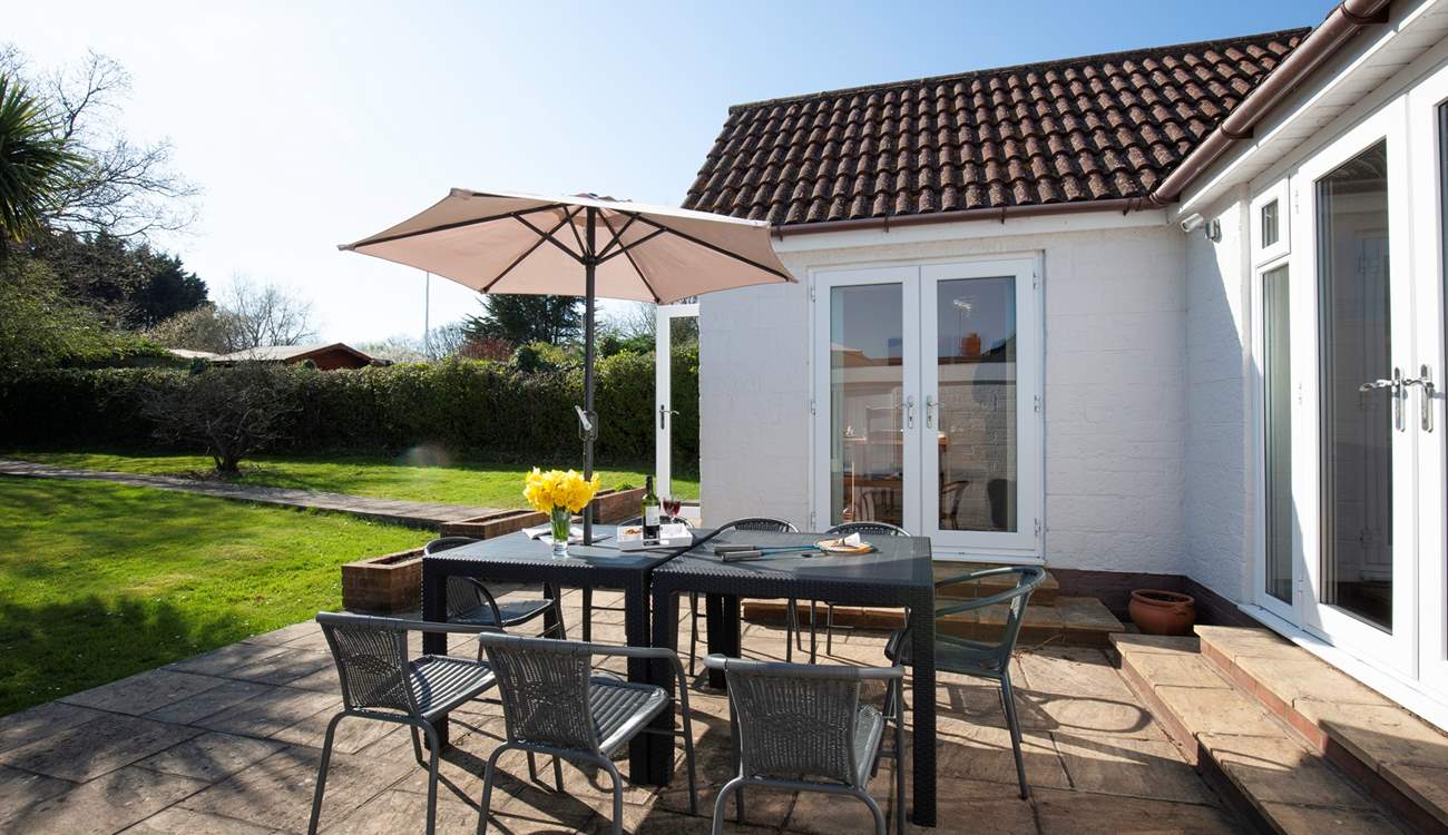 There's a large patio-area with garden furniture.