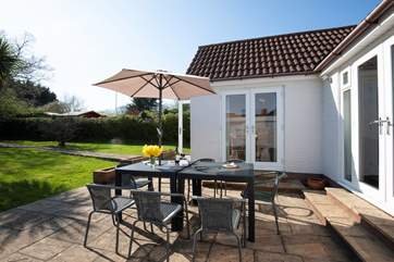 There's a large patio-area with garden furniture.