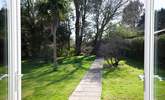 The patio doors from the dining-room and sitting-room open out onto the secluded garden. - Thumbnail Image