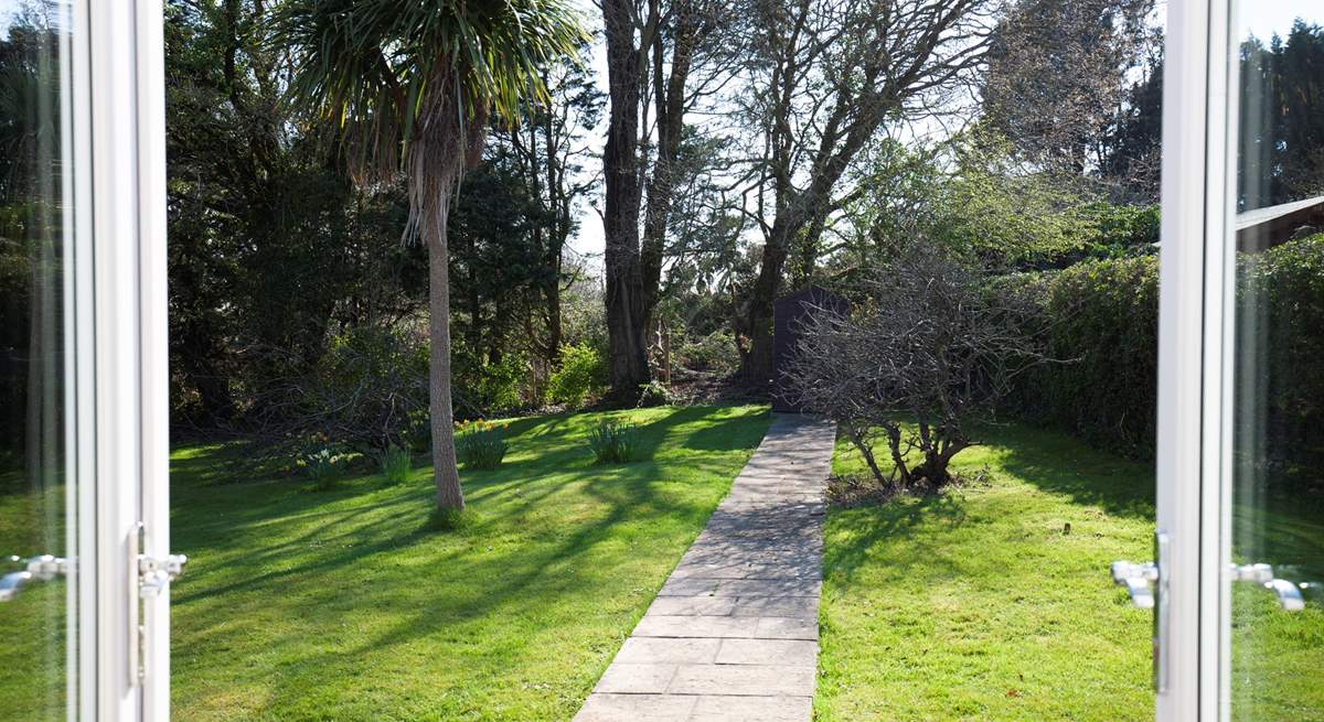 The patio doors from the dining-room and sitting-room open out onto the secluded garden.