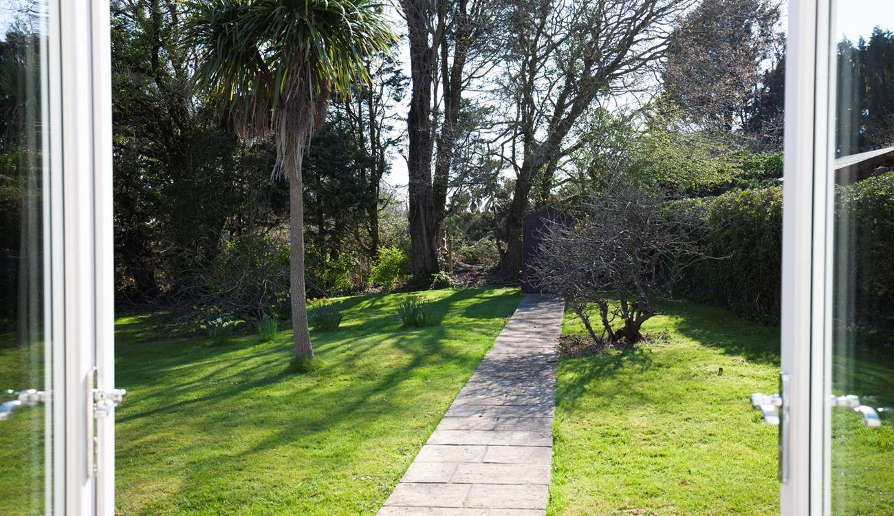 The patio doors from the dining-room and sitting-room open out onto the secluded garden.