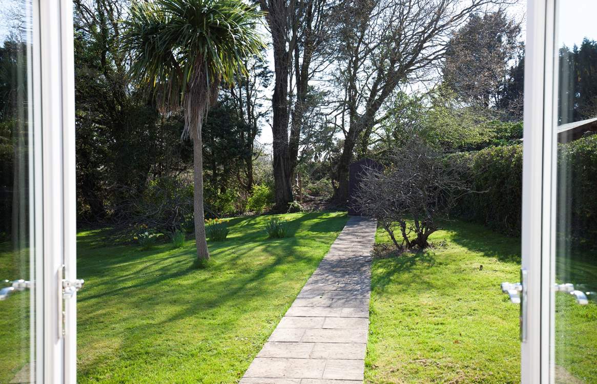 The patio doors from the dining-room and sitting-room open out onto the secluded garden.