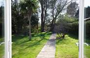 The patio doors from the dining-room and sitting-room open out onto the secluded garden.
