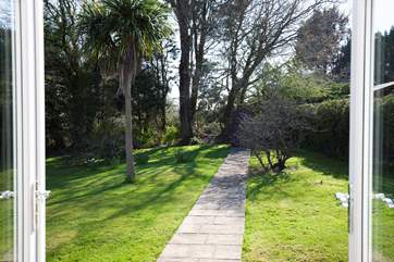 The patio doors from the dining-room and sitting-room open out onto the secluded garden.