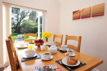 The bright dining-room has dual aspect windows and lots of natural light.