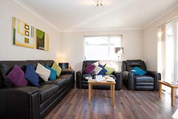 The sitting-room looks out onto the garden.