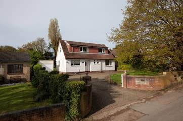 The house is located in a quiet residential lane.