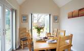 The bright dining-room has dual aspect windows and lots of natural light. - Thumbnail Image