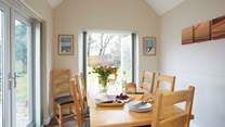 The bright dining-room has dual aspect windows and lots of natural light.