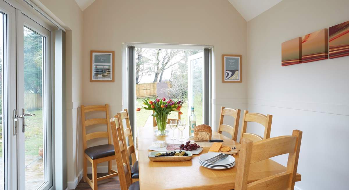 The bright dining-room has dual aspect windows and lots of natural light.