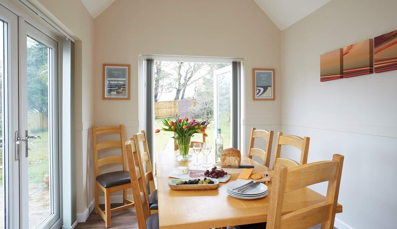 The bright dining-room has dual aspect windows and lots of natural light.
