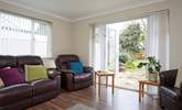 The sitting-room looks out onto the garden. - Thumbnail Image