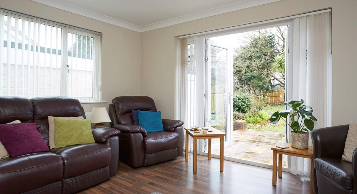 The sitting-room looks out onto the garden.