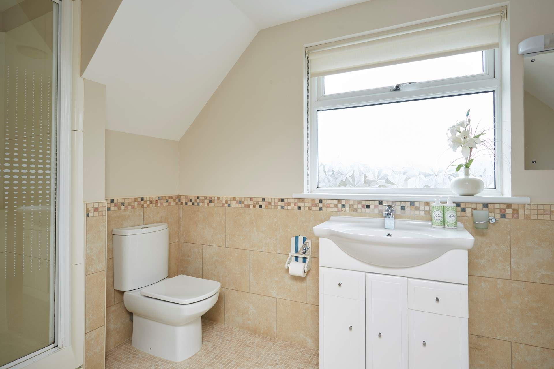 The master en suite bathroom with bath and separate shower.