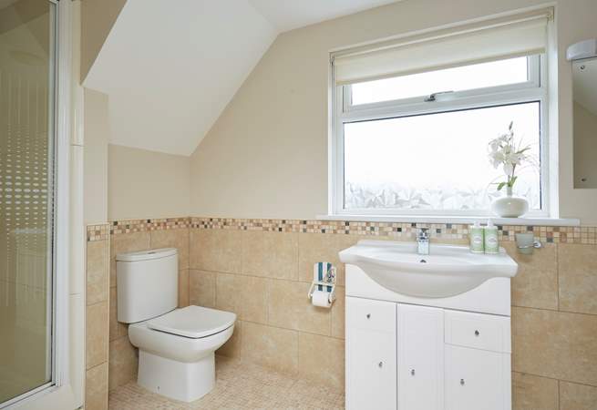 The master en suite bathroom with bath and separate shower.