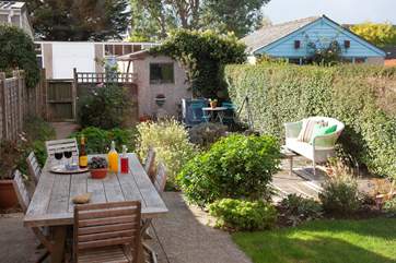 An idyllic, private garden that is nicely appointed.