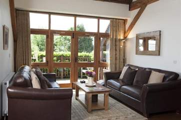 Living area with patio doors and soft seating