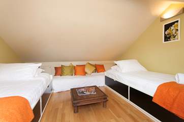 The twin bedroom is tucked away in the eaves of Lawn End, which is more suitable for older children due to the steep ladder and head restriction.