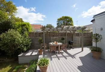 The decking is a delightful space to light up the barbecue on a summer evening.