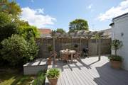 The decking is a delightful space to light up the barbecue on a summer evening.