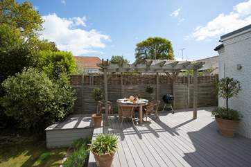 The decking is a delightful space to light up the barbecue on a summer evening.