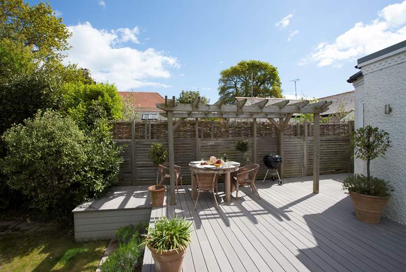The decking is a delightful space to light up the barbecue on a summer evening.