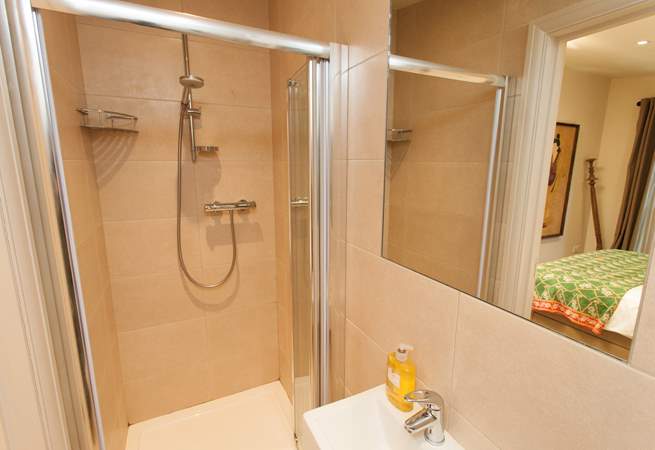 The en suite off the master bedroom has a shower to wash away the sand from in between your toes.