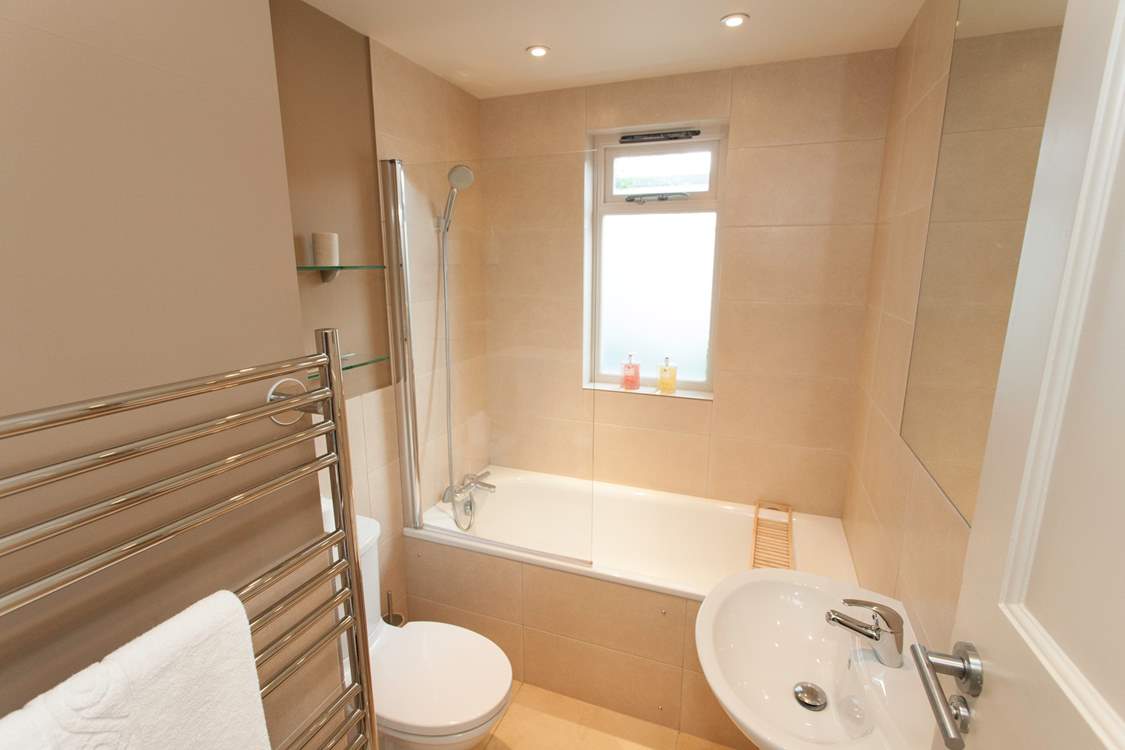Have a relaxing bubble bath with a glass of wine.