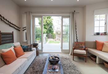 On a warm day, open up the patio doors from the living-room out to the lovely garden.