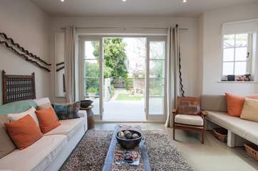 On a warm day, open up the patio doors from the living-room out to the lovely garden.