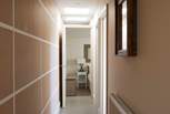 The corridor leads to the cosy bedrooms.