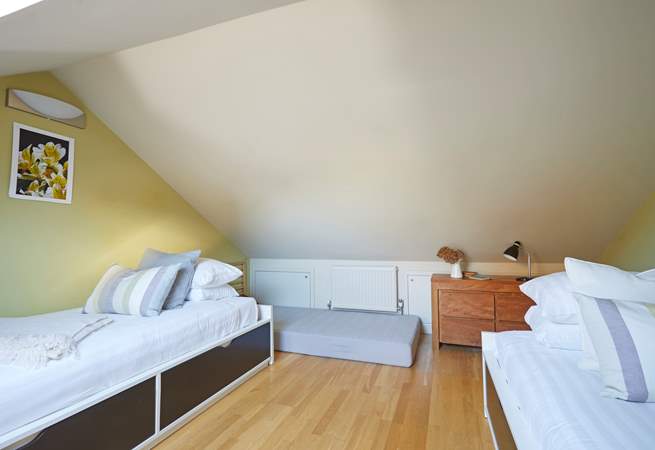 Bedroom 3 is a snug space with twin beds.