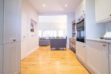 The open plan living-room with kitchen and dining area is ideal for the whole family to spread out.