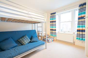 The second floor bunk room. Please note the bottom bunk bed is a futon pull out bed, and suitable for children only.