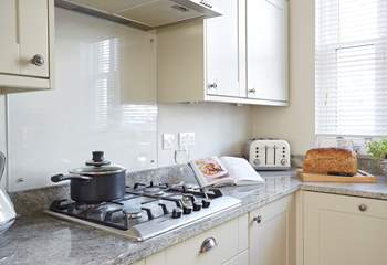 The lovely kitchen offers plenty of space and light.
