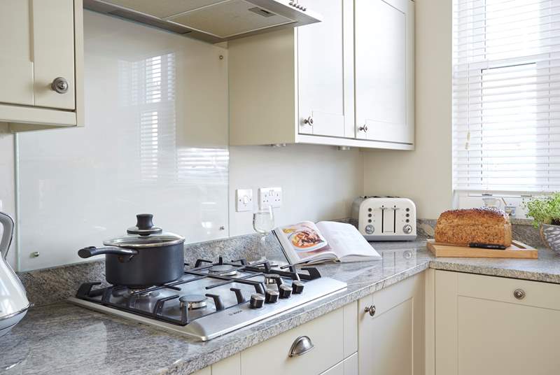 The lovely kitchen offers plenty of space and light.