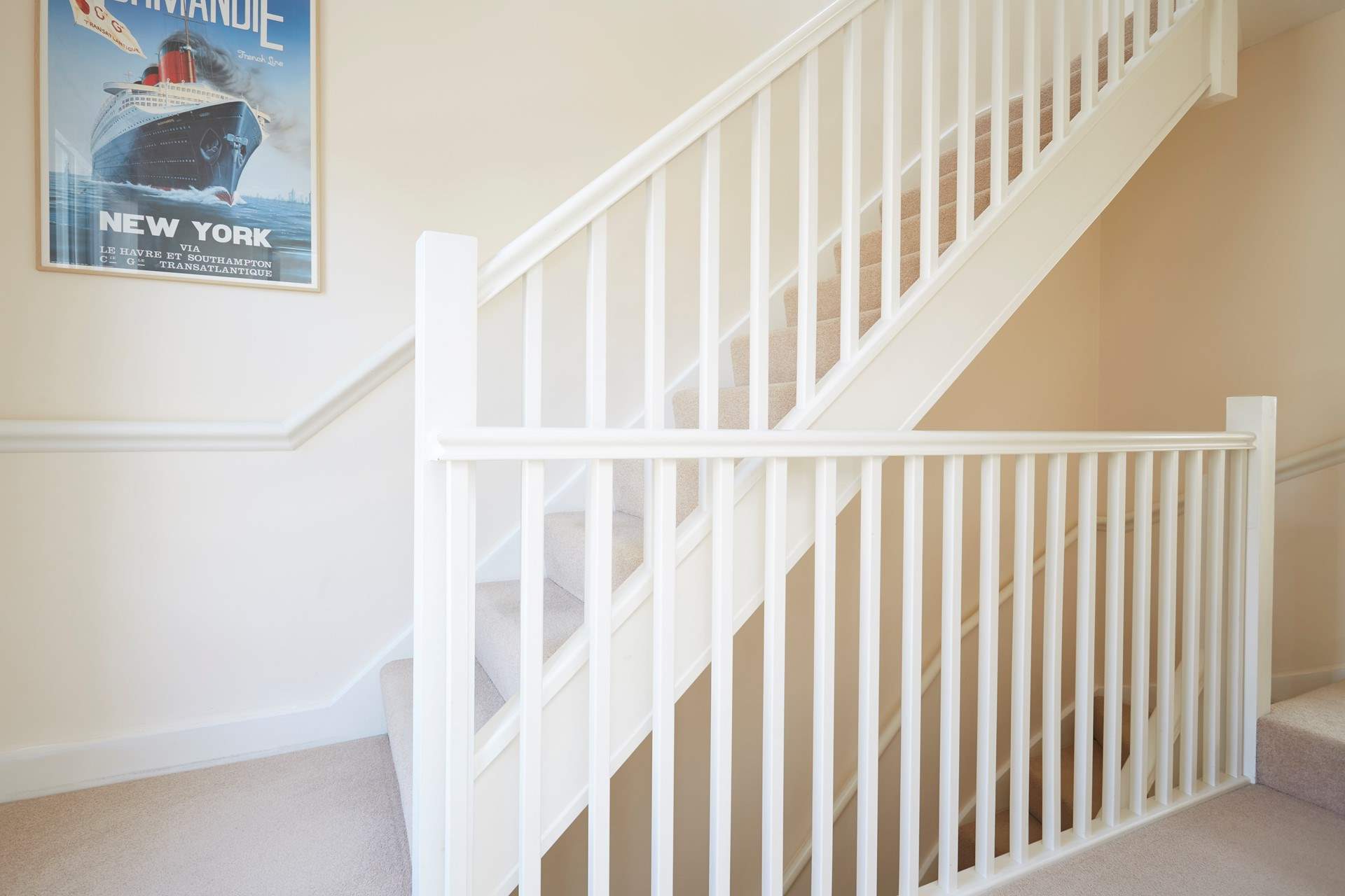 The first floor landing leading up to the second floor.