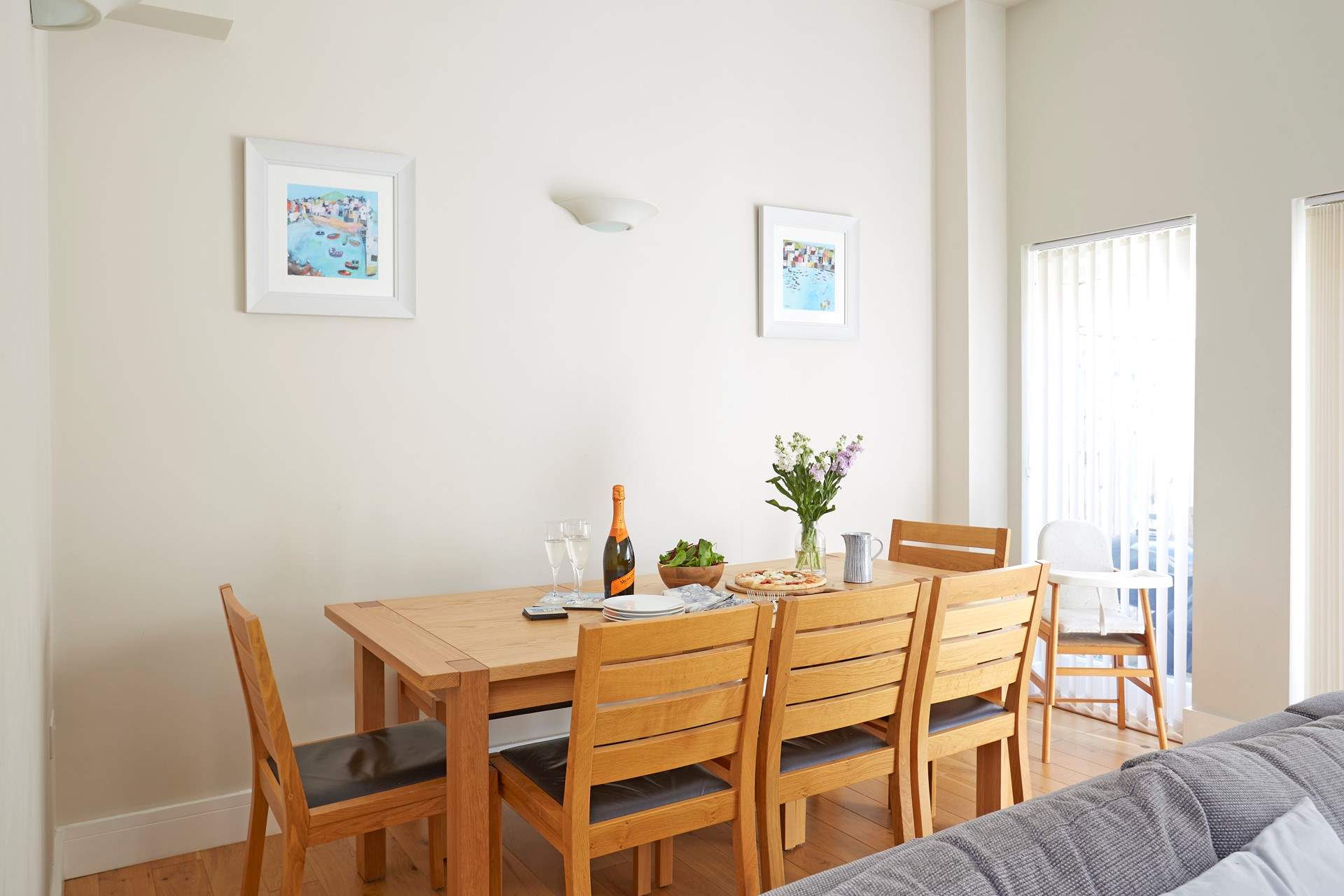 The dining table with 5 chairs and long bench to accommodate your party, plus a high chair for the little one. 