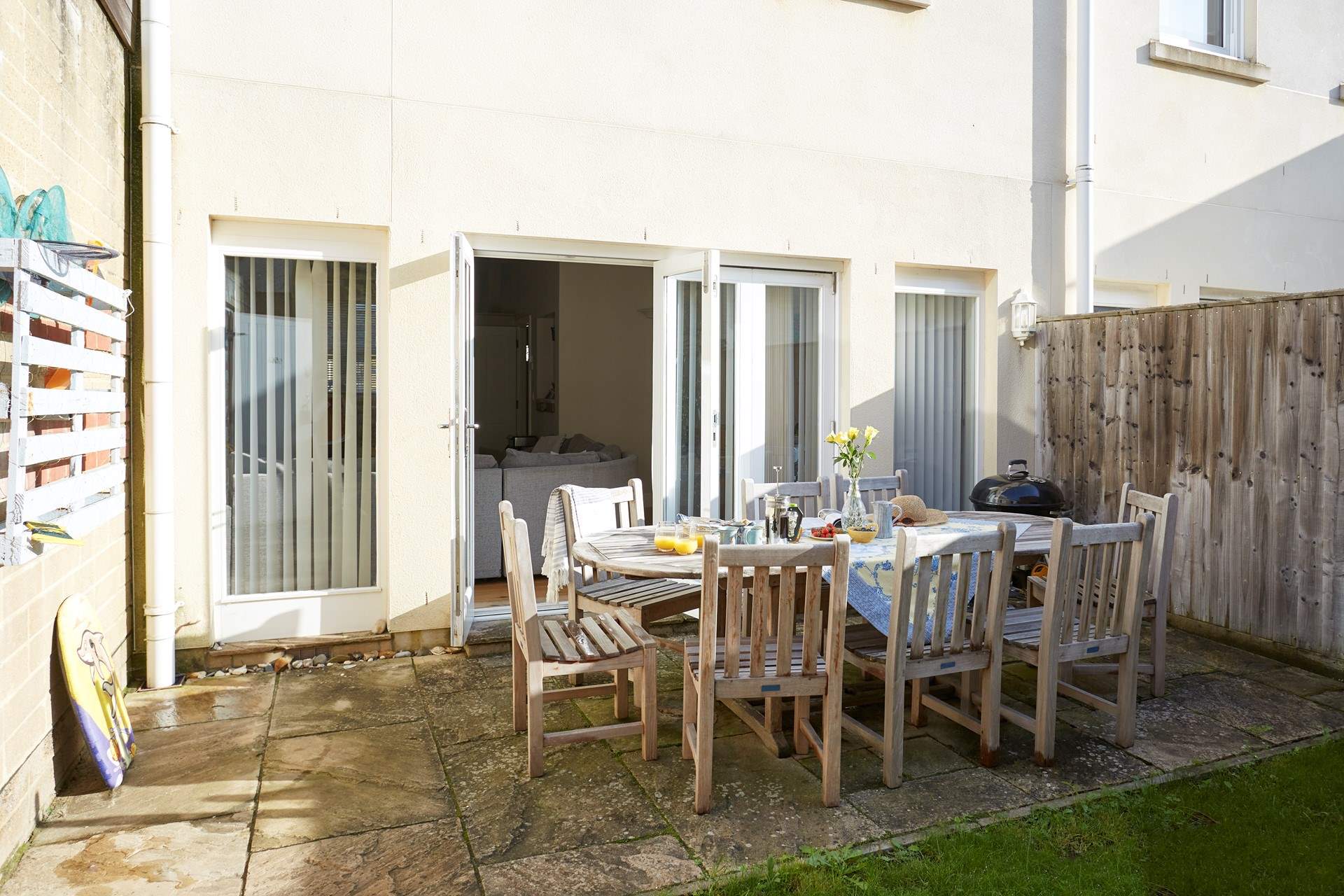 The enclosed patio garden also has a charcoal barbecue.