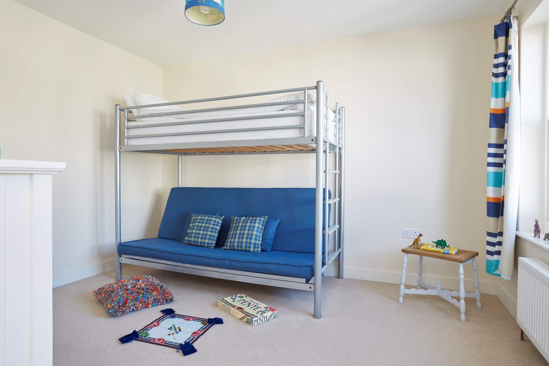 The second floor bunk room. Please note the bottom bunk bed is a futon pull out bed, and suitable for children only.