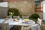 Great outdoor space for eating al-freso with sturdy quality patio furniture in the garden.