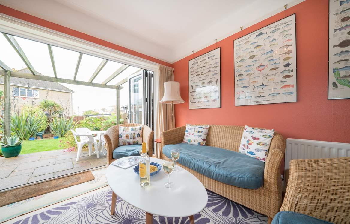 There are two sets of bi-folding doors leading out to the patio area.
