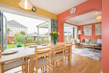 The open plan living-room with kitchen and dining areas.