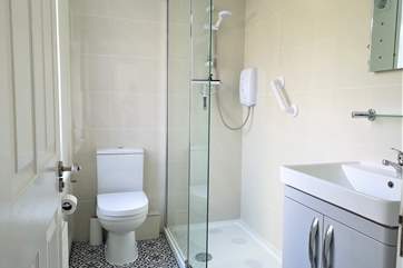 The clean and bright shower room.