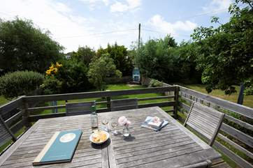 The decked patio to the rear of the cottage is a quiet place to relax with a glass of wine or cup of tea.