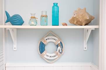 The seaside decor is charming and fresh.