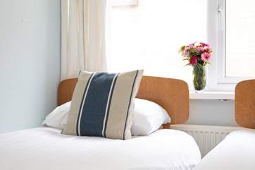 The comfortable twin room is charming and bright.