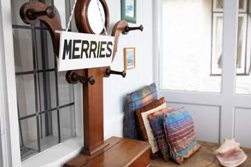 It offers a charming sun-room to the front of the property.